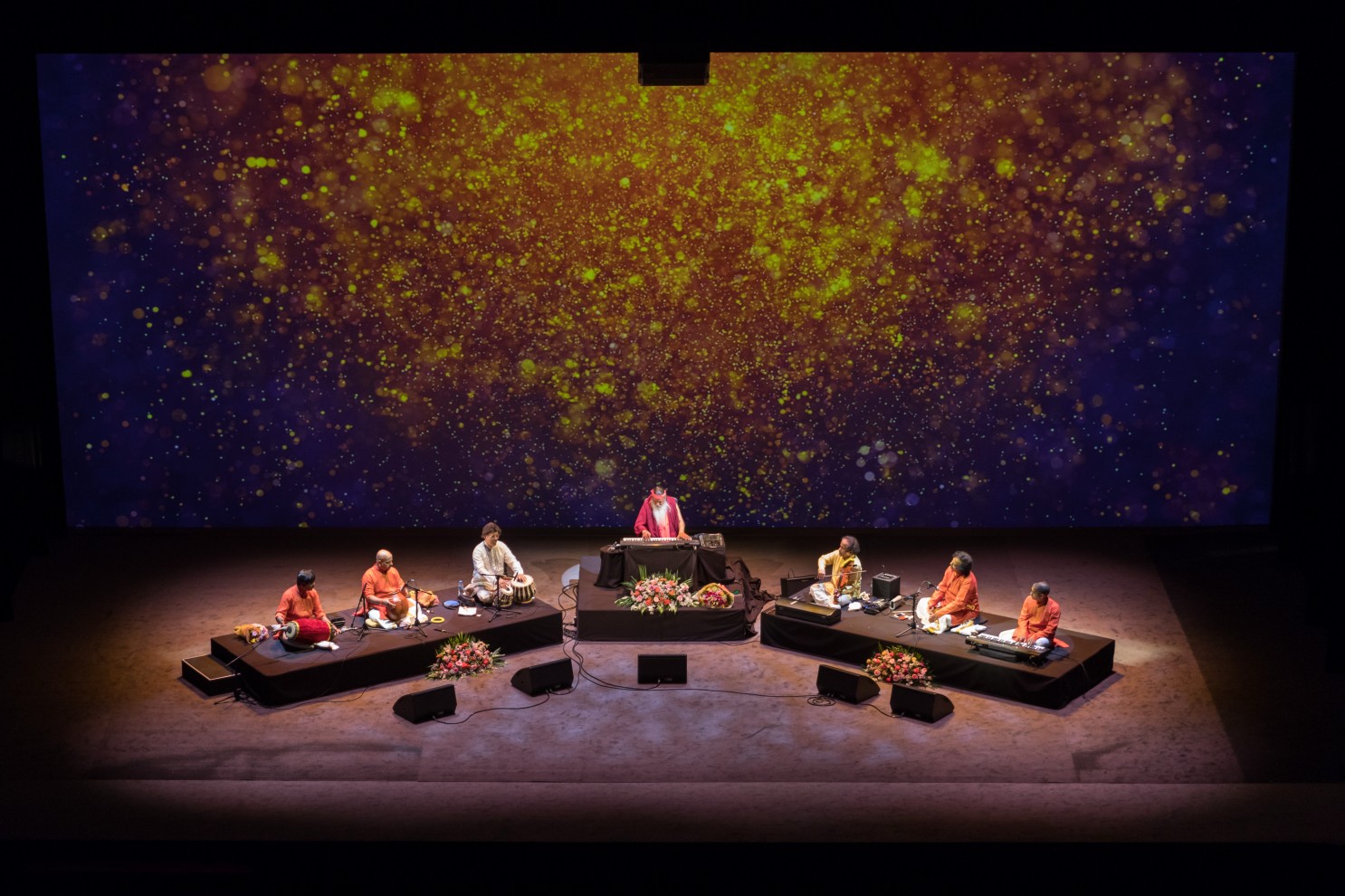 Concert — Sri Swamiji with ensemble, starfield backdrop