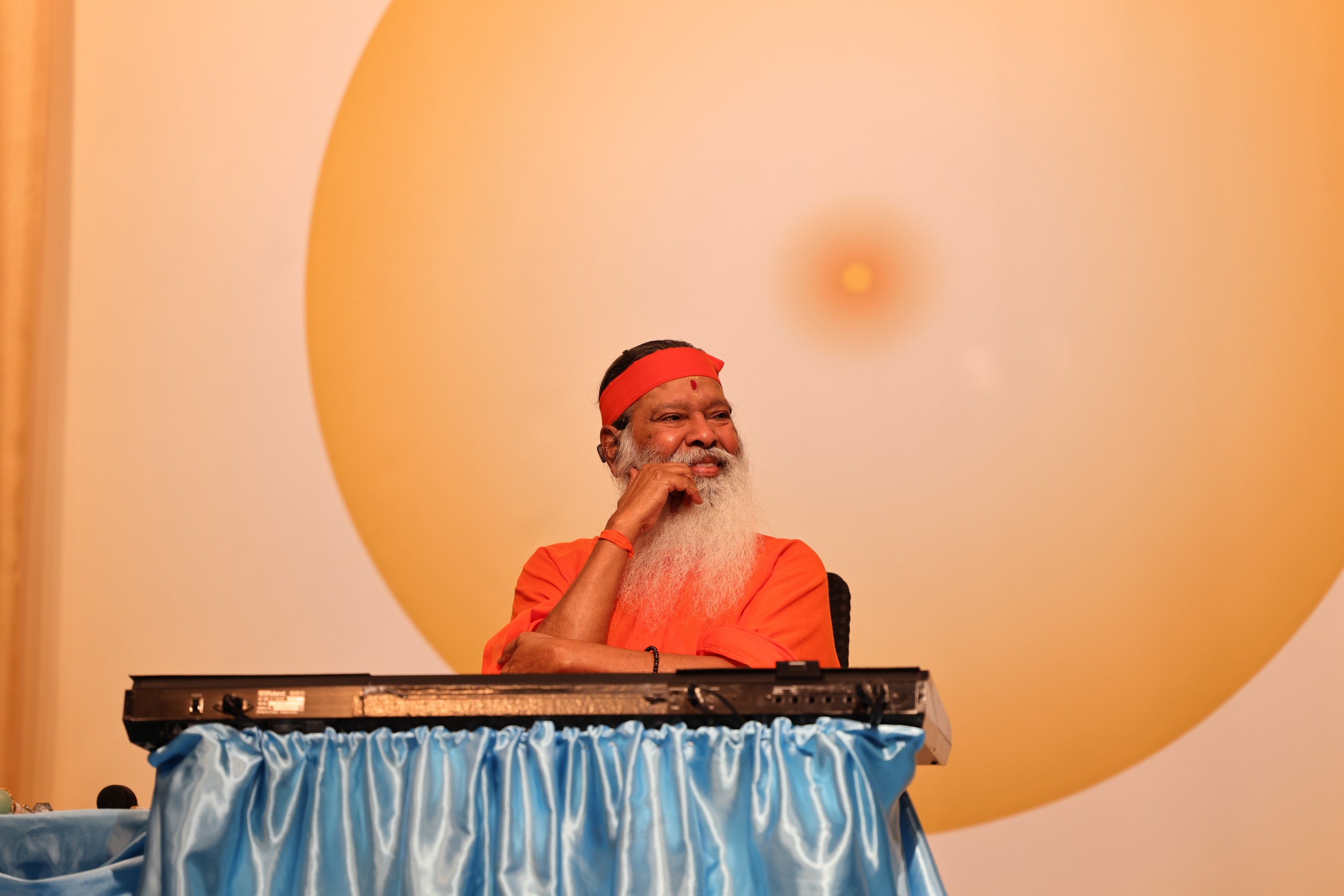 Sri Swamiji smiling at keyboard